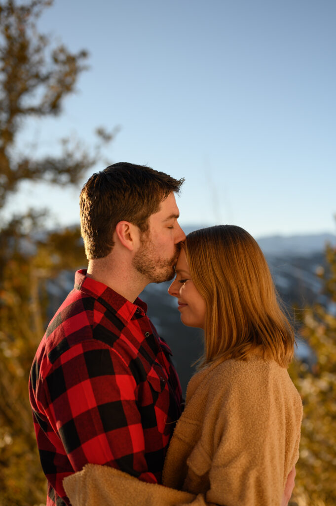 Couple in front of snowy mountain