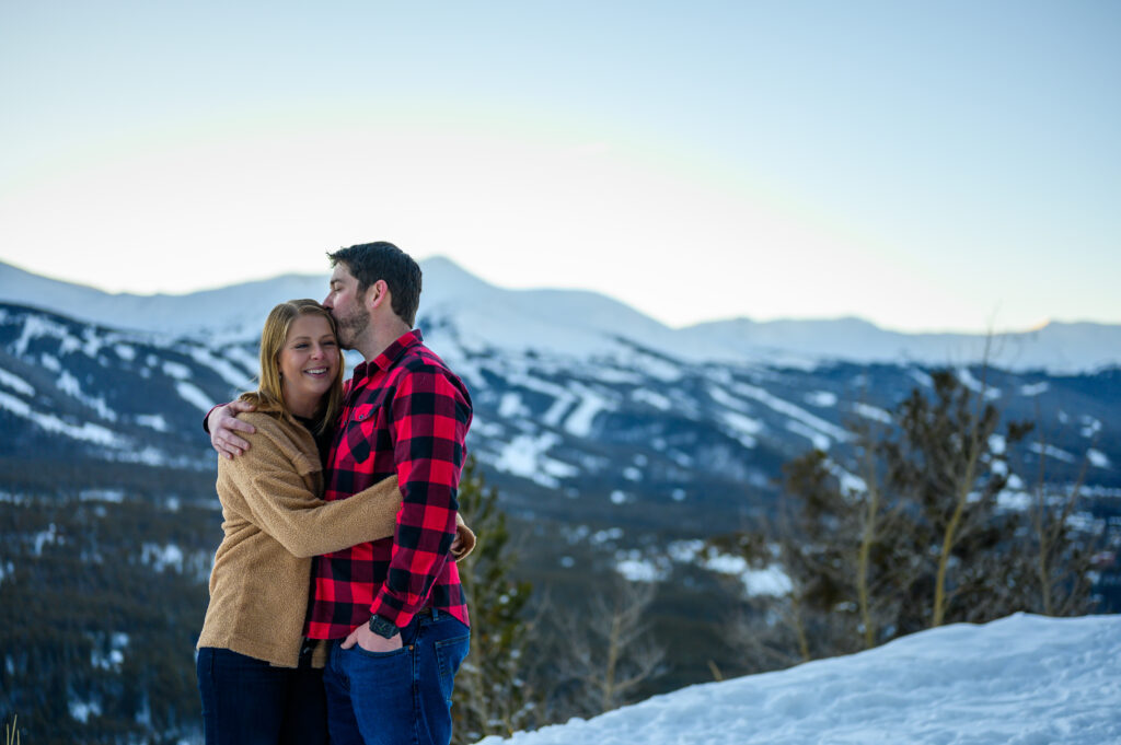 Couple in front of snowy mountain